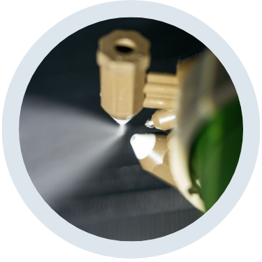 two nozzles spraying towards each other